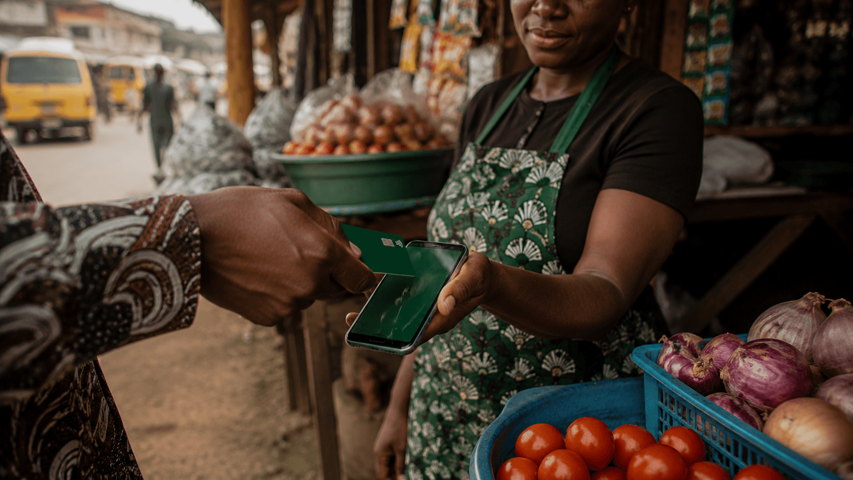 Market trader accepting a tap-to-pay card